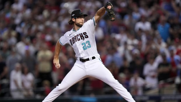 Oct 21, 2023; Phoenix, Arizona, USA; Arizona Diamondbacks starting pitcher Zac Gallen (23) throws a pitch against the Philadelphia Phillies in the first inning during game five of the NLCS for the 2023 MLB playoffs at Chase Field. Mandatory Credit: Joe Camporeale-USA TODAY Sports